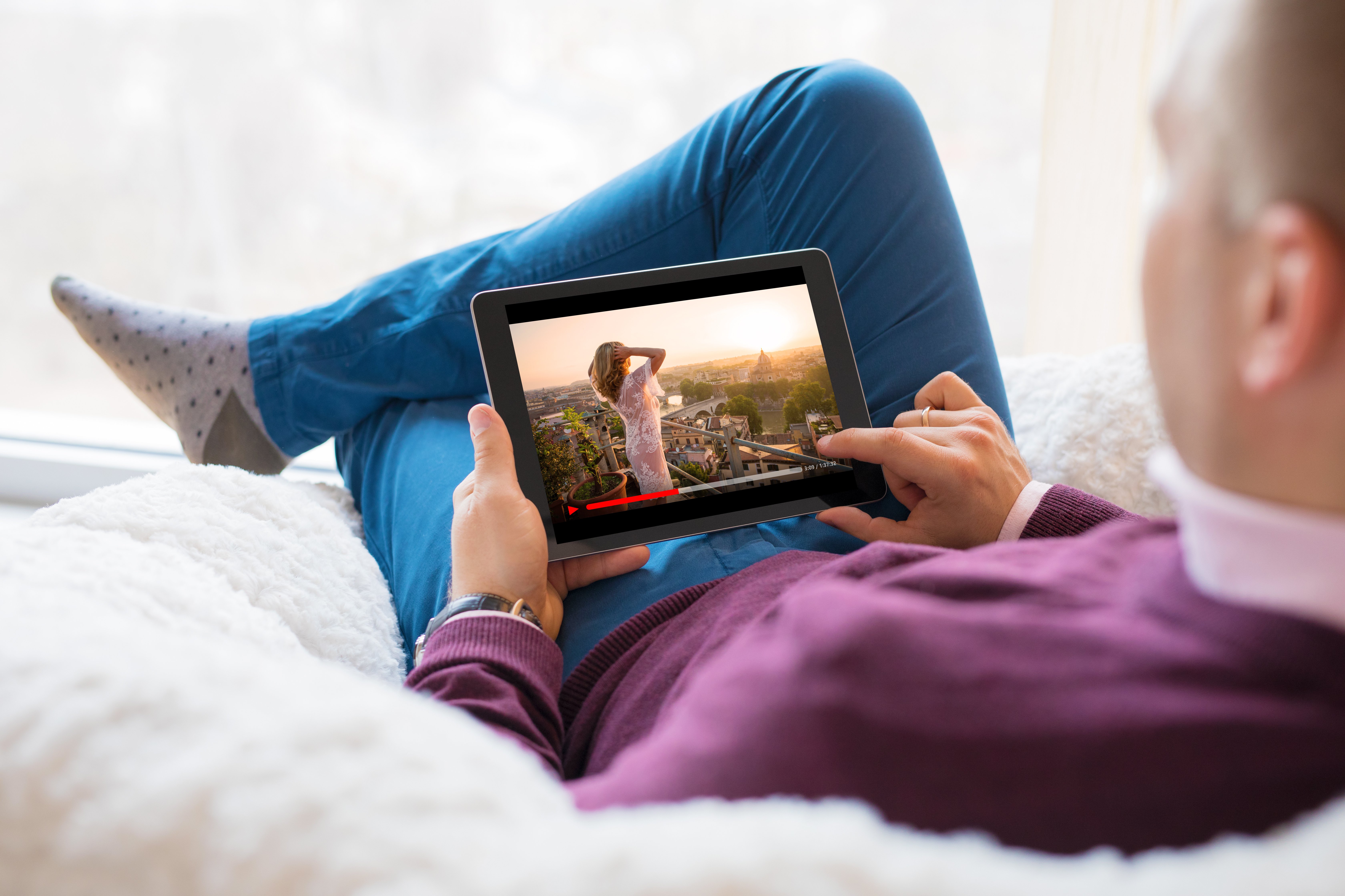 Man viewing content on his tablet