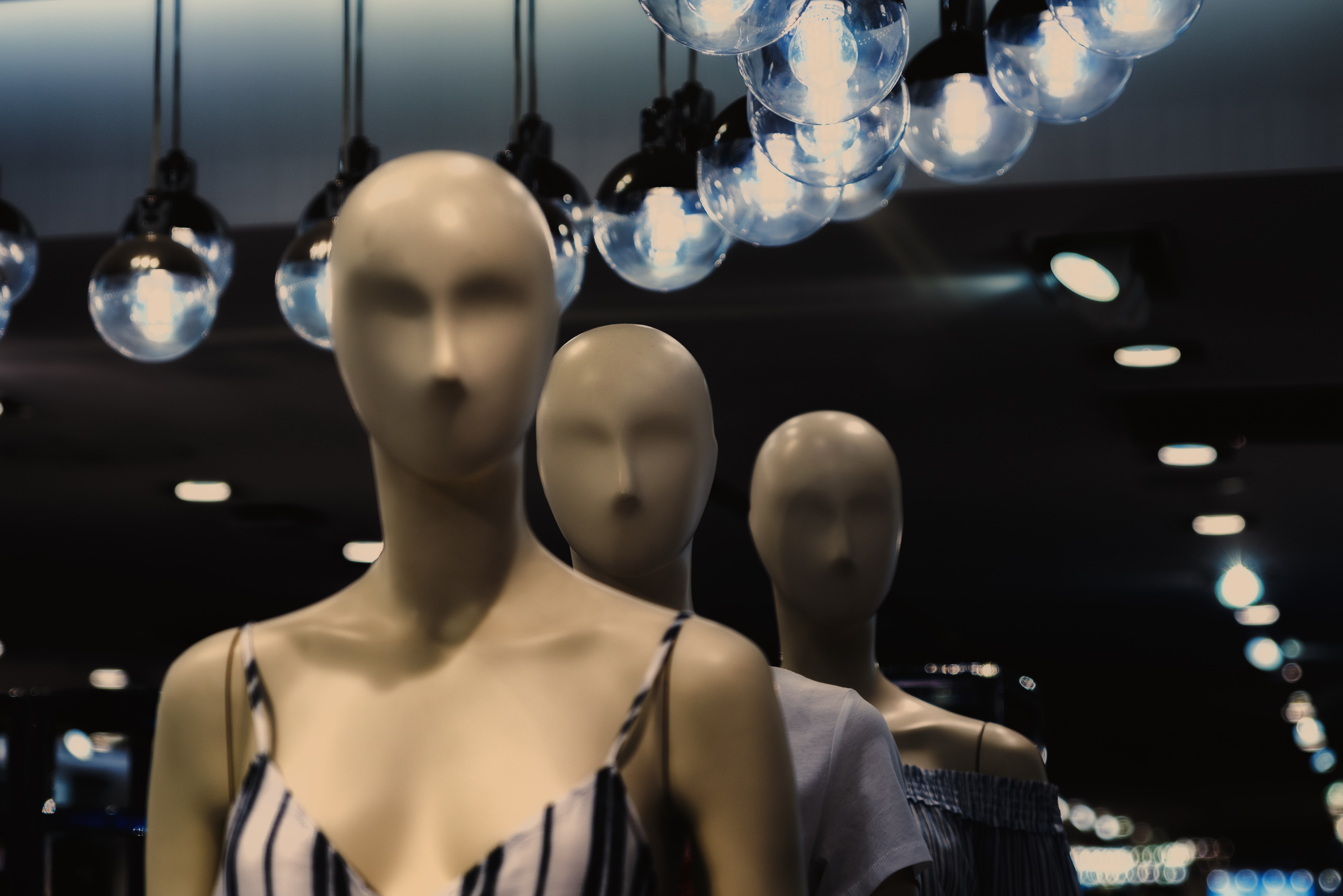 mannequins standing in a line