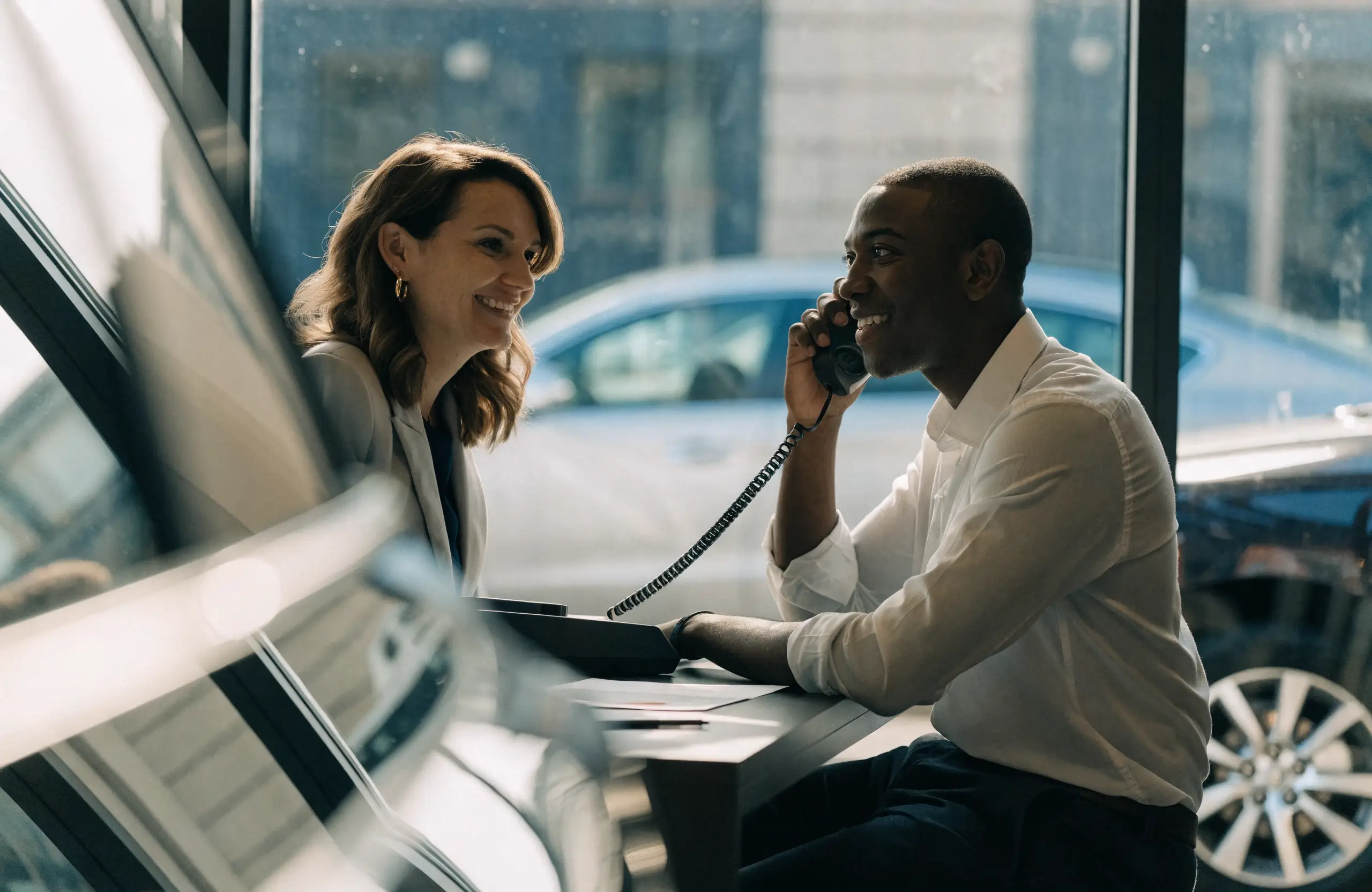 Dealership salesperson following up with a customer by phone