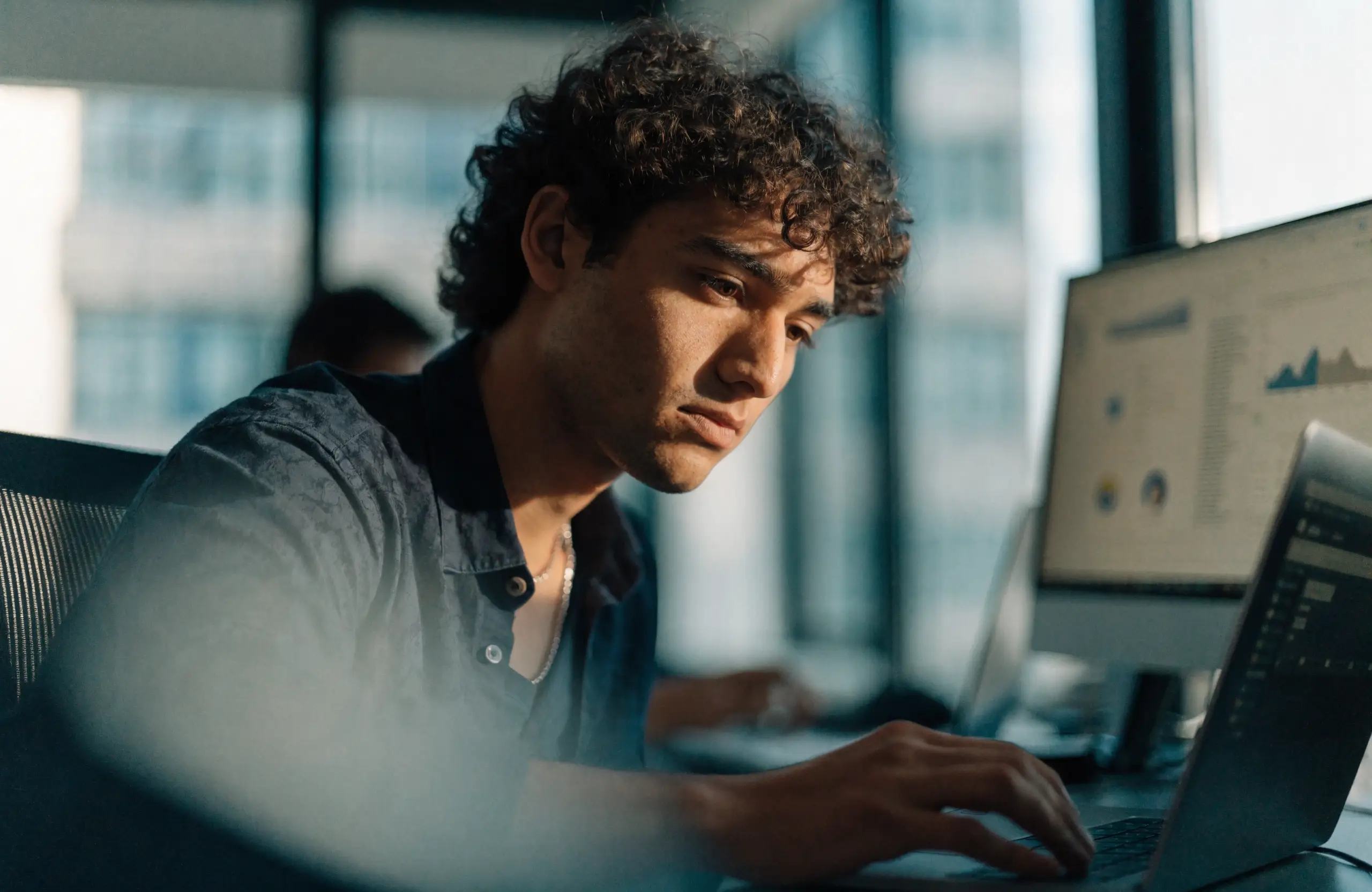 ecommerce-technical-seo-site-speed - Caffeinate Digital Developer reviewing online store performance and site speed on a laptop